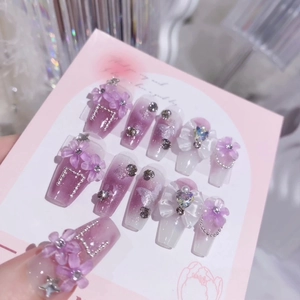 Handmade purple galaxy press-on nails with 3D iris flowers and pearls set