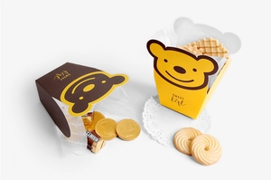 Detail view of cartoon bear candy boxes for wedding favors and party gift packaging