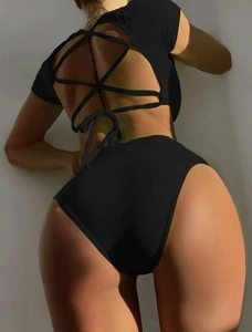 Detail of black bikini with back lace-up drawstring design and high waisted shorts