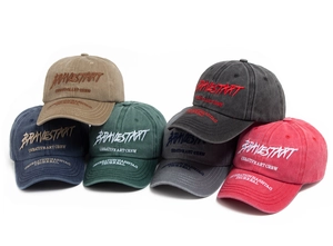Close-up of vintage washed cotton baseball caps with 3D embroidery in six diverse colors