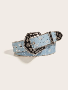 Detail of light blue denim belt with silver sequins and vintage metal buckle closure