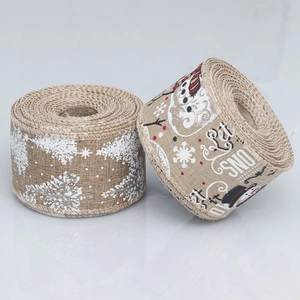 Detail of Christmas burlap ribbons with snowflake patterns and Let it Snow snowman prints
