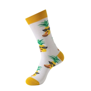 Close-up of knit cotton socks with yellow heel and cartoon pineapple print