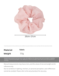 Detail view of pink ruffled scrunchie showing 20-21cm size diameter and fabric texture