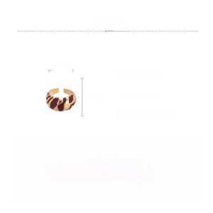 Detailed view of wide gold alloy ring with enamel patterns and 2.5cm size dimensions