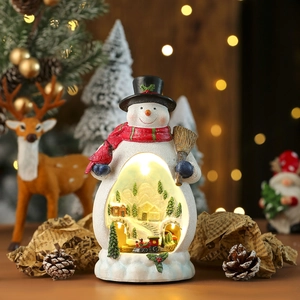 Macro shot of snowman figurine with built-in glowing miniature village LED Christmas scene