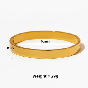 Detail view of 60mm diameter gold-plated stainless steel bangle with 8mm width and 29g weight