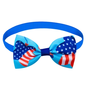 Detail of US flag pattern pet bowtie featuring patriotic stars and stripes on grosgrain ribbon
