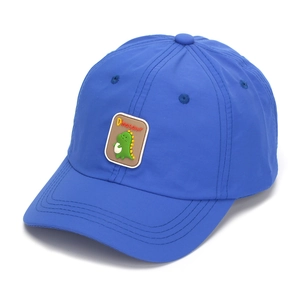 Detail of navy blue kids baseball cap showing fast-dry fabric and 3D dinosaur patch