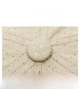Macro shot of breathable beige mesh fabric and fine stitching on a sun baseball cap