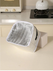 Detail of insulated lunch bag with waterproof aluminum foil lining and white trim