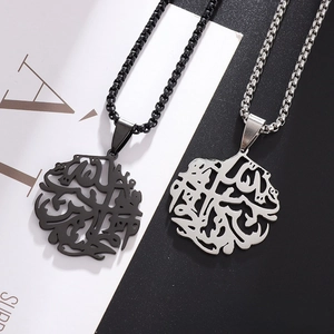 Close-up of tree of life hollow pendant necklaces in black and silver on split background