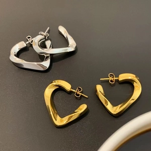18K gold and silver plated twisted heart-shaped hoop earrings in a minimalist 3D design