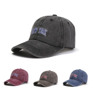 Detail showing vintage washed cotton baseball caps with New York embroidery in four colors
