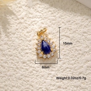 Detail view of 18K gold plated teardrop pendant with blue stone and size specs
