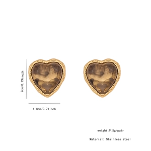 Macro shot of Maillard style heart earrings showing 2cm size and amber texture detail