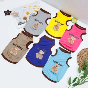 Flat lay of breathable mesh pet vests in six colors with cute teddy bear prints