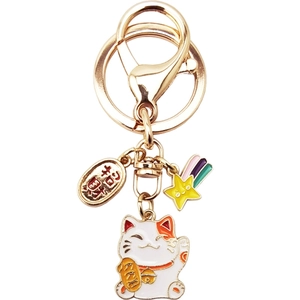 Japanese lucky cat keychain with golden hardware and招财进宝 fortune charms
