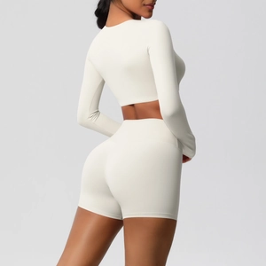 Detail of creamy white double-sided brushed long sleeve crop top and high waist sports shorts