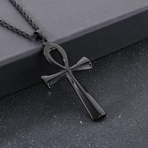 Close-up of a polished black stainless steel Ankh cross pendant with twist chain