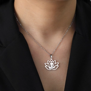 Silver lotus meditation pendant necklace featuring a hollow flower and yoga silhouette