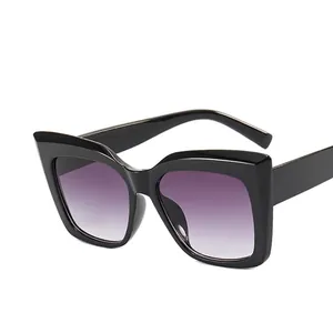 Fashionable oversized cat eye sunglasses with black frames and purple gradient lenses