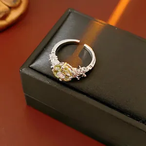 Elegant adjustable flower open ring featuring light green pear-shaped zircon stones