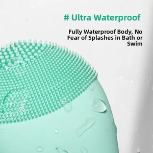 Close-up of mint green silicone facial cleanser with water droplets showing waterproof feature