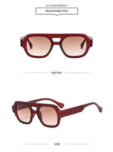 Detailed view of red striped rectangular sunglasses with double bridge and gradient lenses