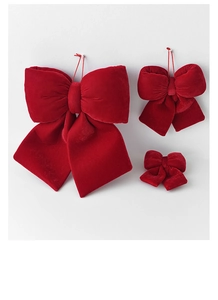 Three-piece set of red velvet Christmas bows in various sizes with hanging loops