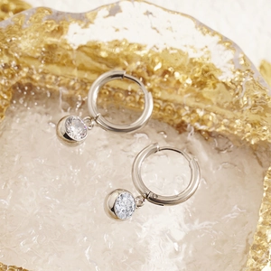 Silver titanium steel hoop earrings featuring dangling clear cubic zirconia crystals