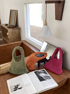 Three colorful woven cotton rope tote bags in green, orange and rose red colors