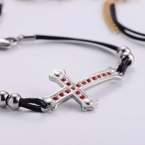 Cross bracelet with red zircons on black woven rope for couples and friends