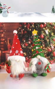 Detailed view of plush Christmas gnomes with knitted hats and festive pinecone accents