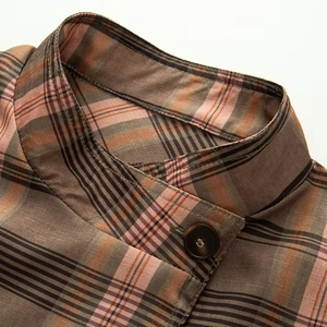 Women's vintage plaid loose shirt jacket featuring a stand collar and button detail