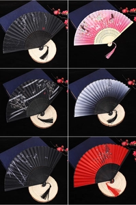 Detailed collage of six vintage folding fans with bamboo, floral, and rabbit patterns