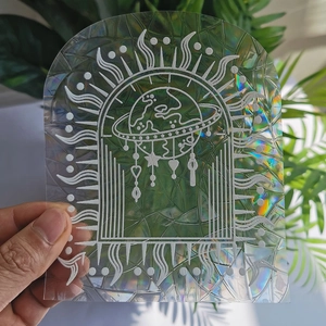 Rainbow suncatcher window film with planet and star decals creating light prism effects