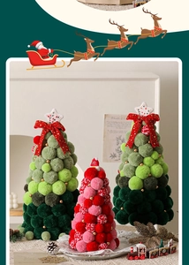 Detail of Christmas pom-pom trees with colorful fuzzy balls and festive star toppers