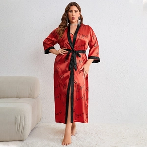 Women's red satin sleepwear set with heart patterns and black contrast silk belt tie