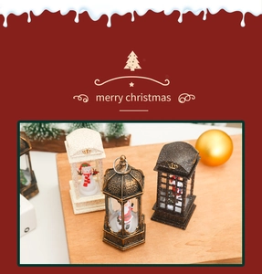 Close-up of vintage LED Christmas lanterns with Santa and snowman figurines inside