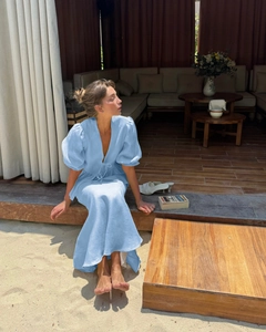 Close-up of V-neckline and drawstring waist on light blue linen blend summer set