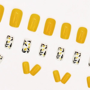 Ginger yellow and floral leaf press-on nails with glossy square oval finish