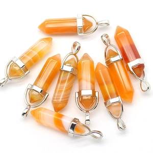 Macro view of assorted hexagonal agate crystal pendants with silver bail clips