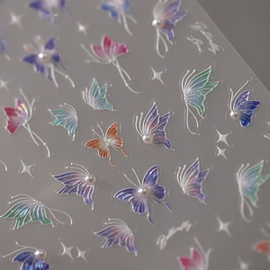 5D butterfly nail stickers with laser iridescent gradient effect and pearl accents