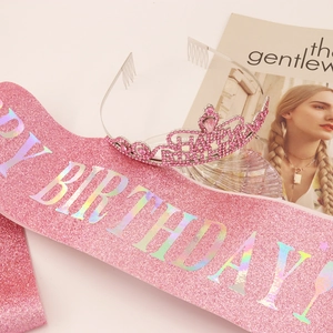 Detailed view of glittery pink Happy Birthday sash and matching rhinestone crown set