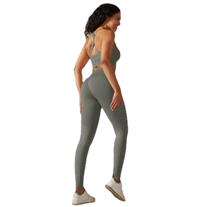 Seamless olive green yoga set with cross-strap sports bra and high-waisted leggings