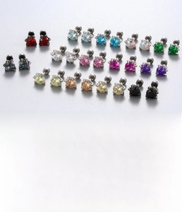 Detail of colorful round zircon ear studs with secure screw back and titanium steel posts