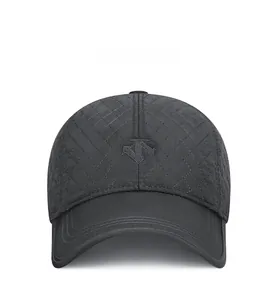 Close-up of grey quilted baseball cap with detailed geometric embroidery and curved visor