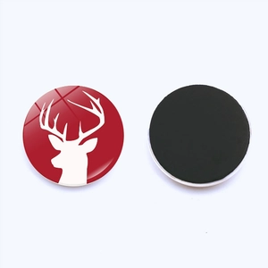 Round Christmas fridge magnet with red reindeer silhouette and crystal glass dome finish