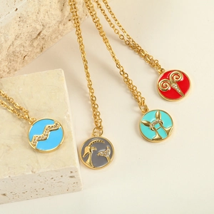 Detailed macro view of colorful enamel zodiac pendants with gold chains and crystals